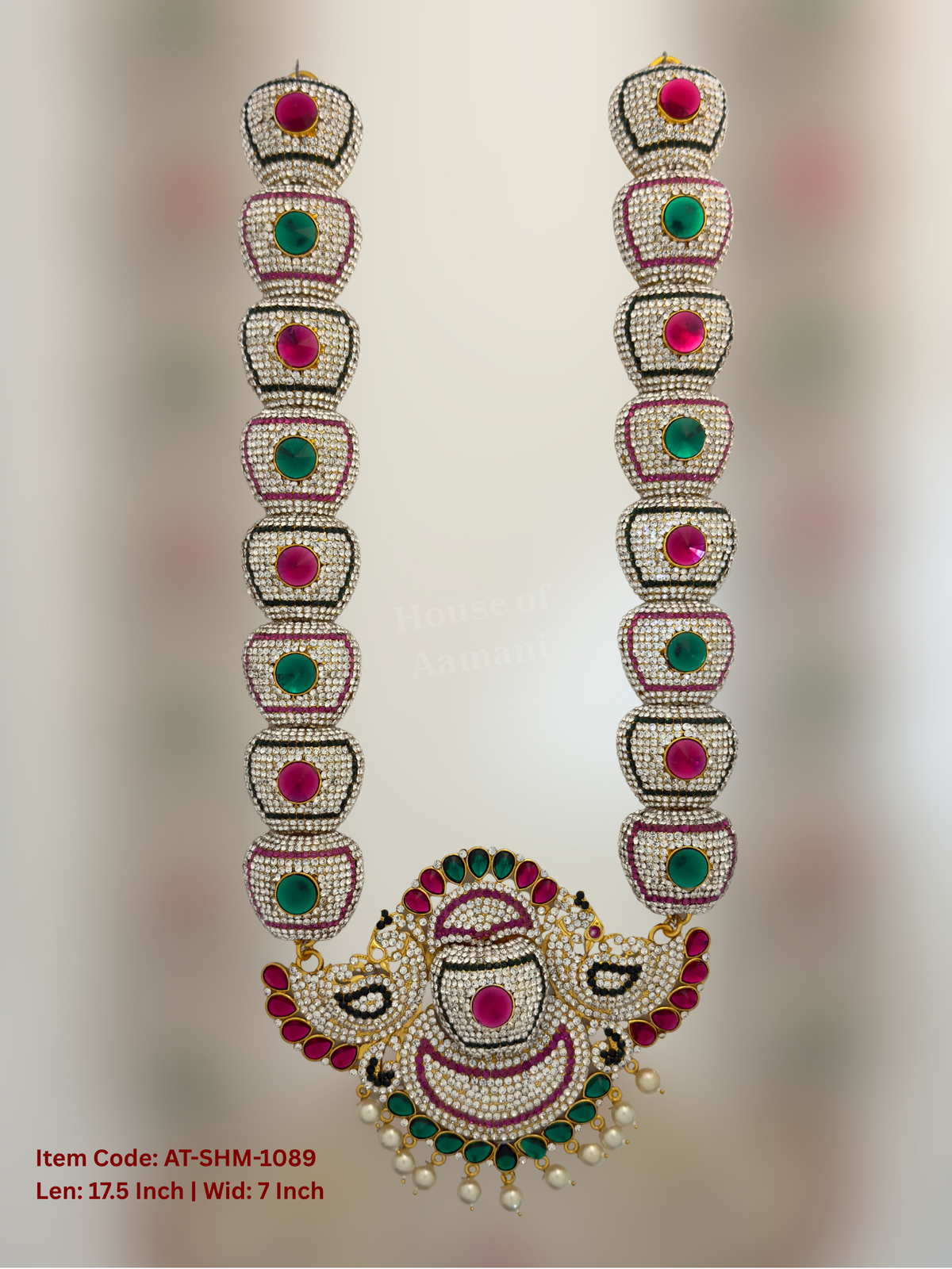 Elevate your deity alankaram with our traditional gold-plated 17.5-inch Swamy Haram with Fuchsia Pink, Green, White Coloured Stones.