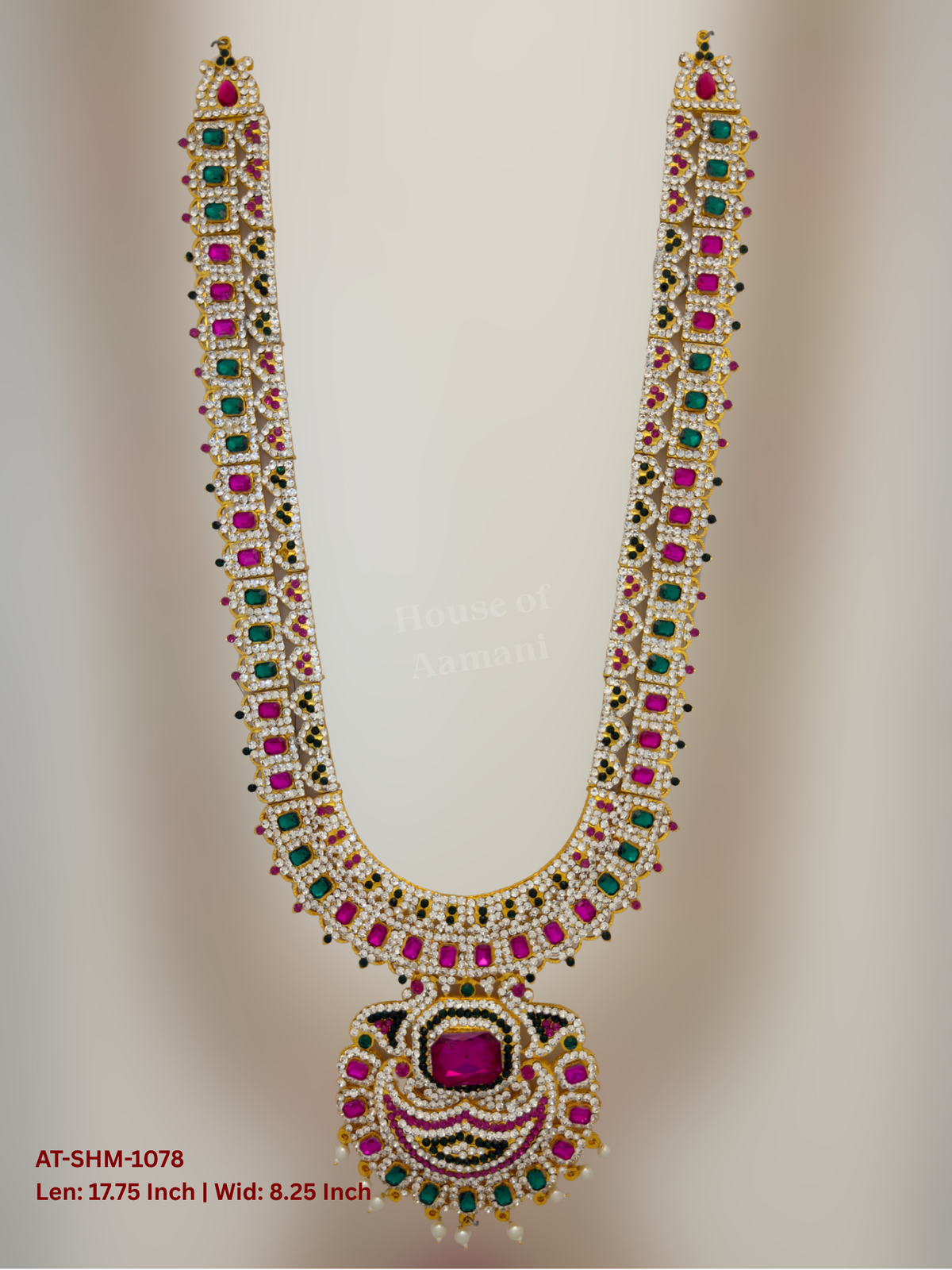 Elevate your deity alankaram with our traditional gold-plated 17.75-inch Swamy Haram with Fuchsia Pink, Green, White Coloured Stones.