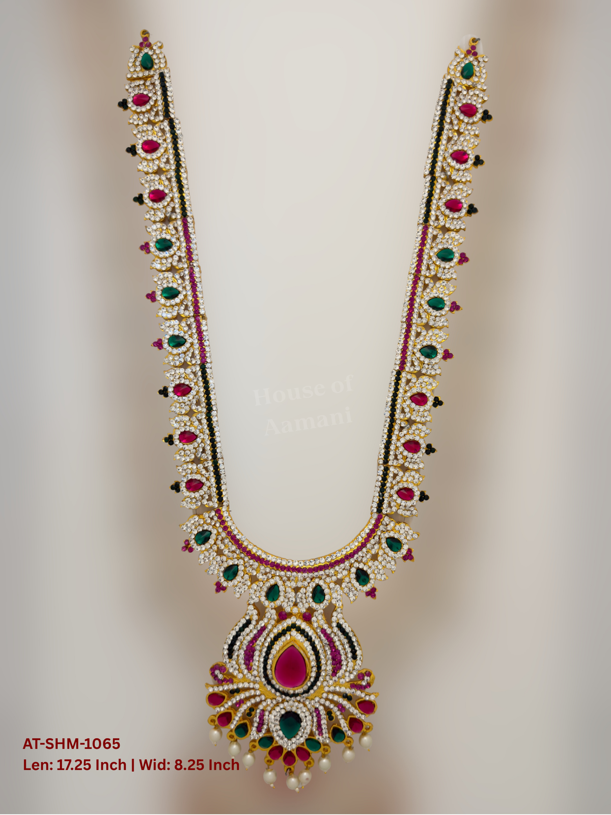 Elevate your deity alankaram with our traditional gold-plated 17.25-inch Swamy Haram with Fuchsia Pink, Green, White Coloured Stones.