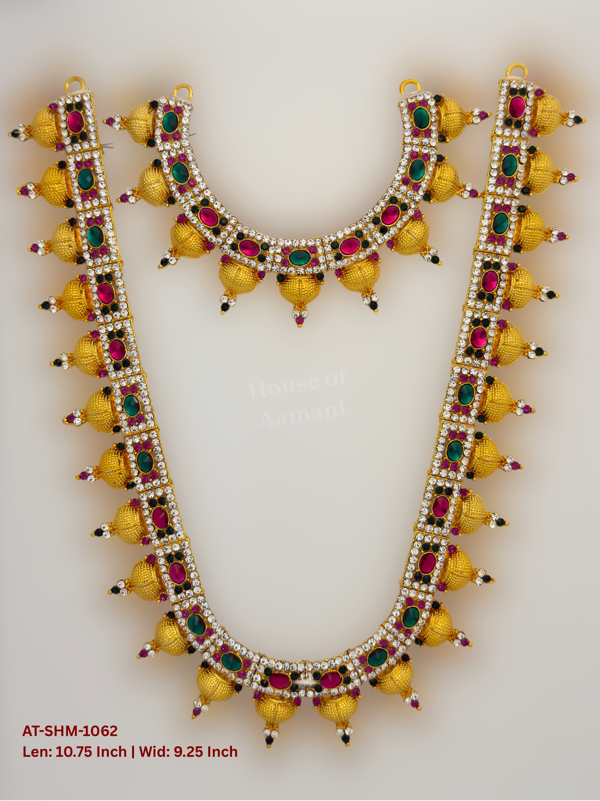 Elevate your deity alankaram with our traditional gold-plated 10.75-inch Swamy Haram with Fuchsia Pink, Green, White Coloured Stones.