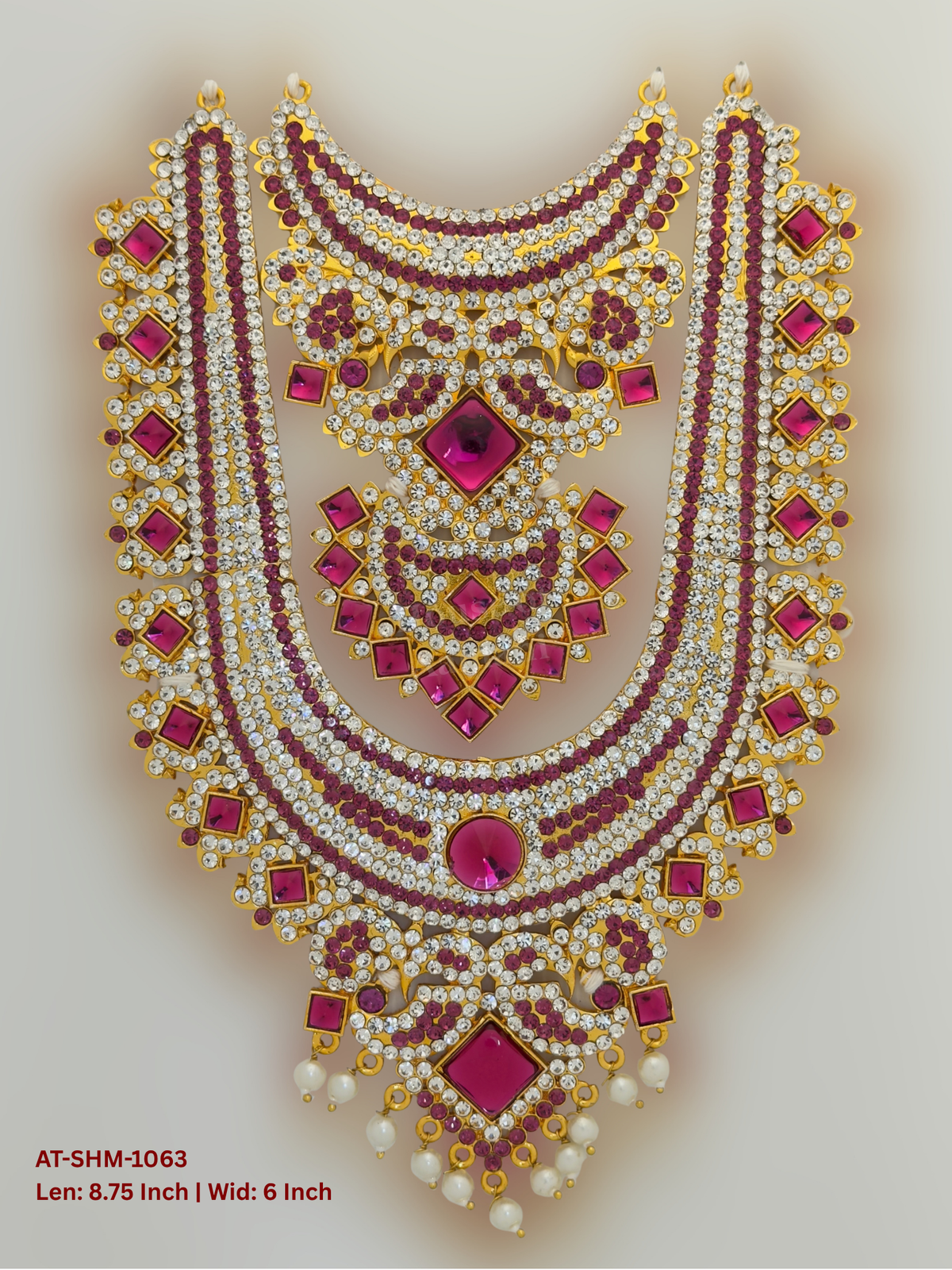 Elevate your deity alankaram with our traditional gold-plated 8.75-inch Swamy Haram with Fuchsia Pink, White Coloured Stones.