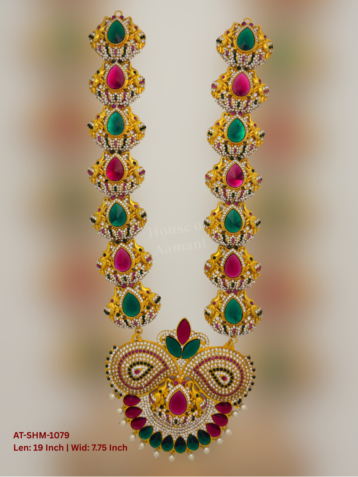 Elevate your deity alankaram with our traditional gold-plated 19-inch Swamy Haram with Fuchsia Pink, Green, White Coloured Stones.