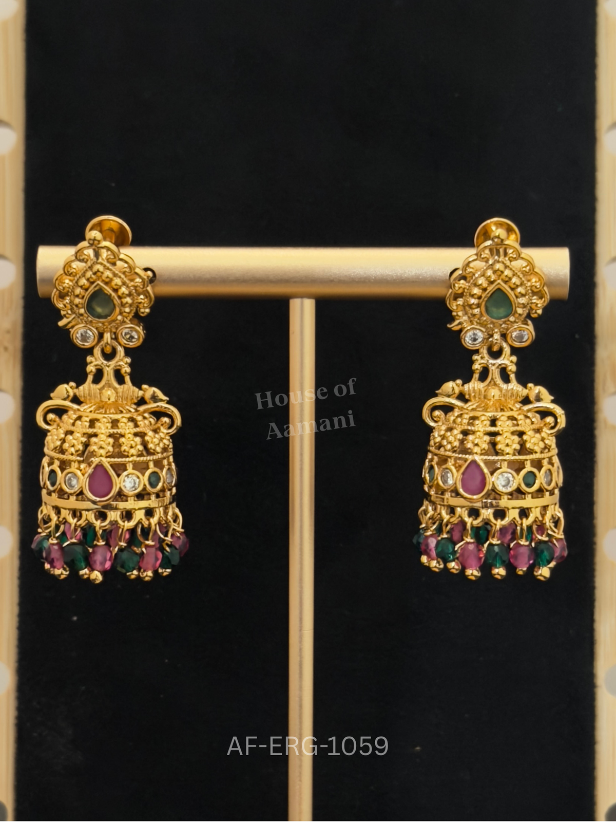 Intricately textured gold domes with granulated detailing, ruby and emerald stones, and colourful bead drops.