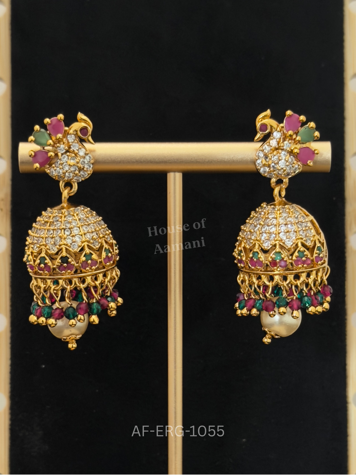 Jewelled peacock studs top a petal-lined dome of crystal, ruby, and emerald, finished with beads and a pearl drop.