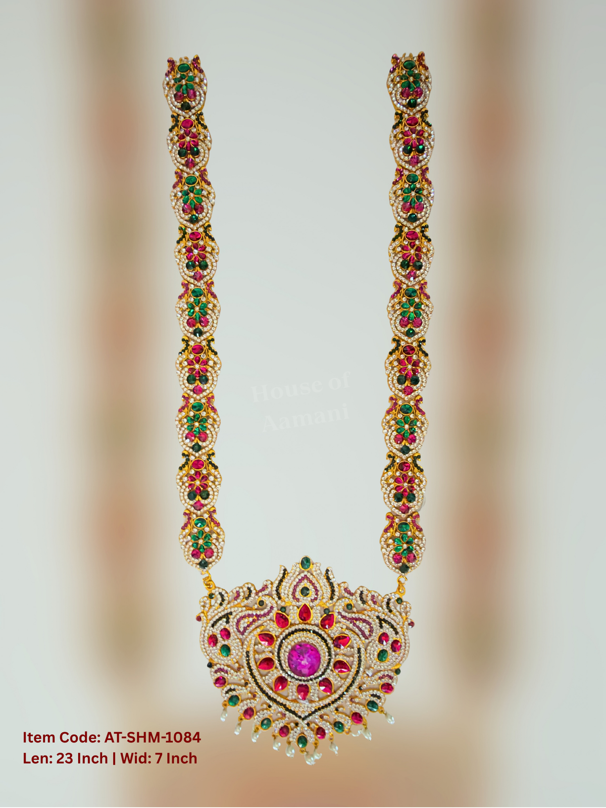 Elevate your deity alankaram with our traditional gold-plated 22.5-inch Swamy Haram with Fuchsia Pink, Green, White Coloured Stones.