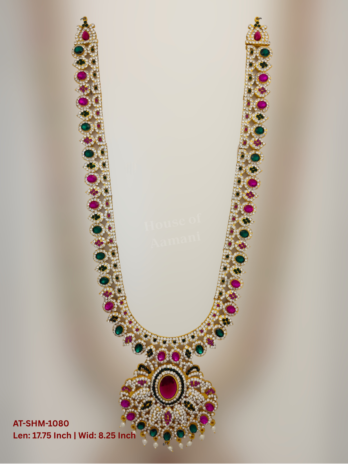 Elevate your deity alankaram with our traditional gold-plated 17.75-inch Swamy Haram with Fuchsia Pink, Green, White Coloured Stones.