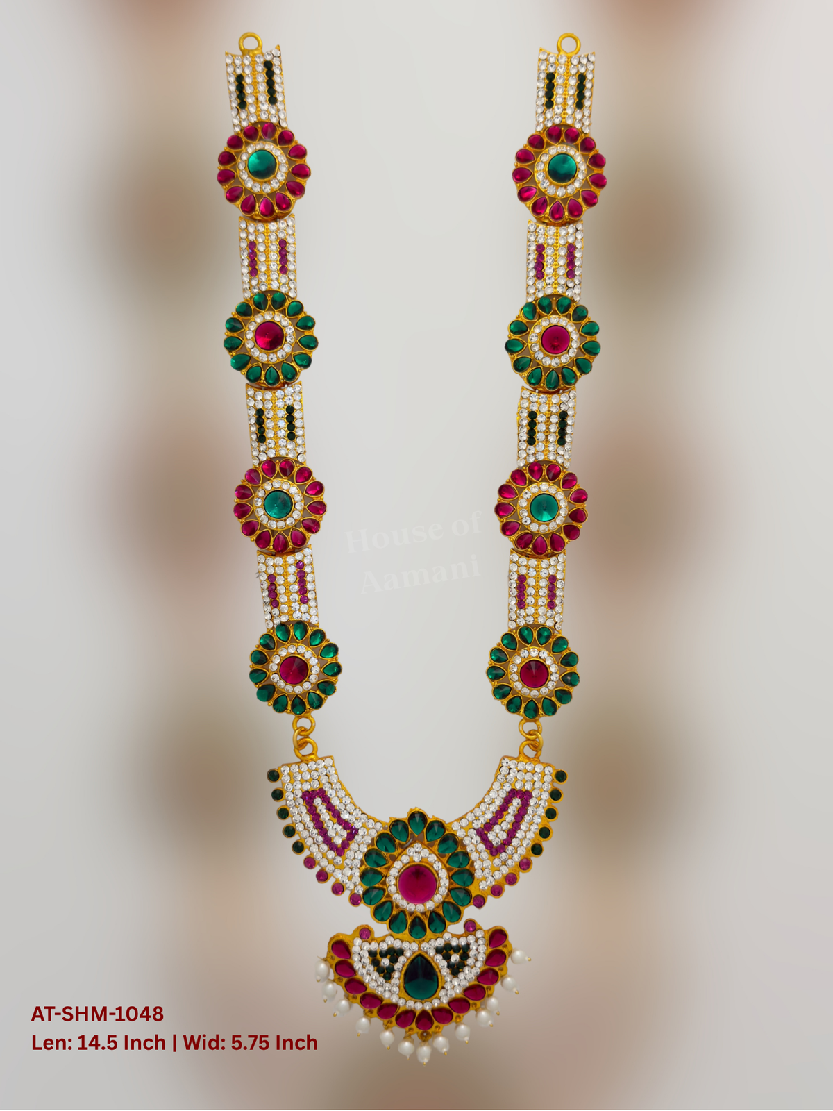 Elevate your deity alankaram with our traditional gold-plated 14.5-inch Swamy Haram with Fuchsia Pink, Green, White Coloured Stones.